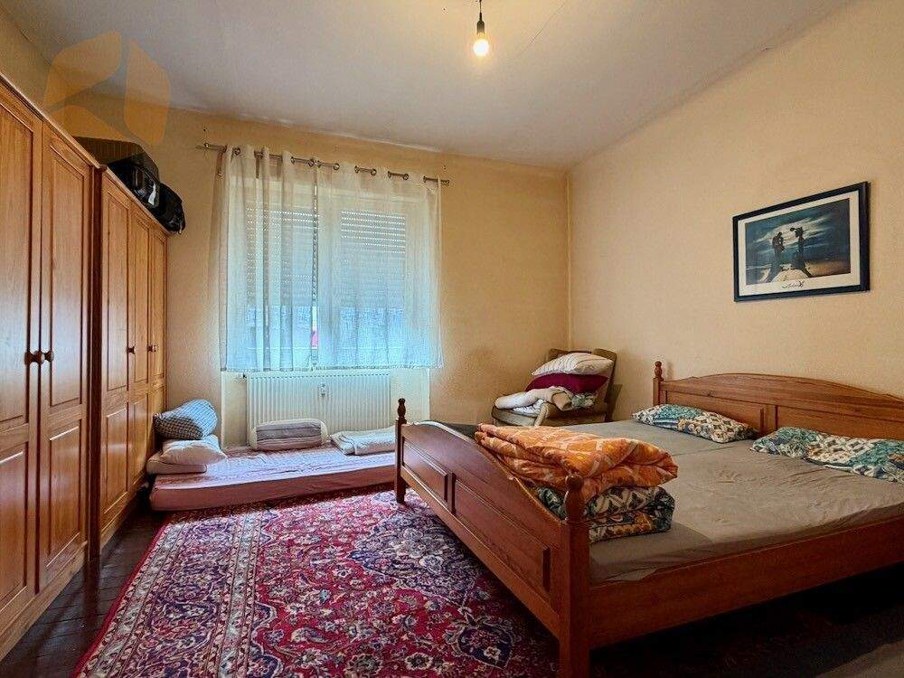 Immobilie in Bexbach - Vermietetes Zweifamilienhaus mit großem Grundstück in Bexbach zu verkaufen - Bild 1