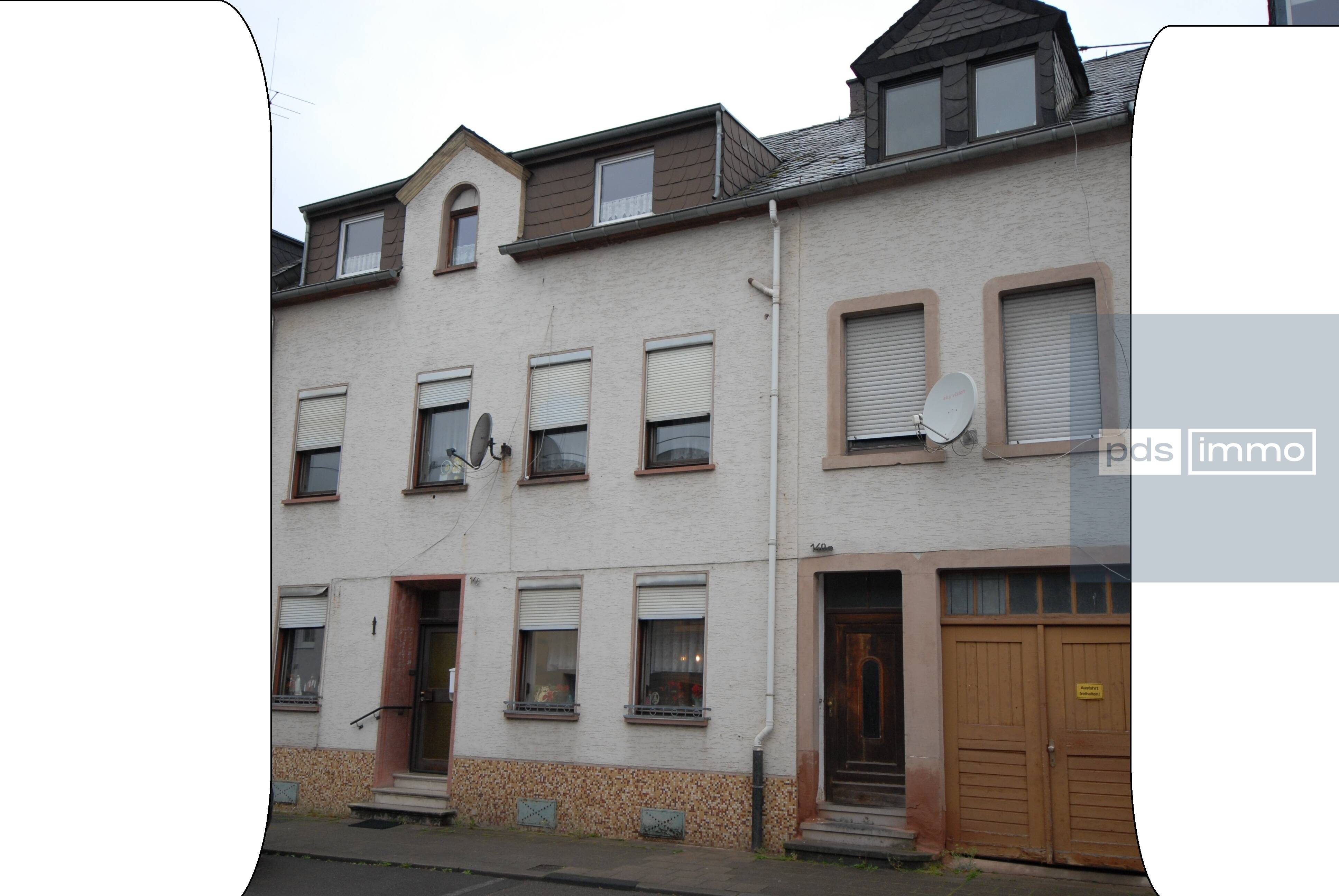 Sanierungsbedürftiges Mehrfamilienhaus mit Potenzial in begehrter Lage